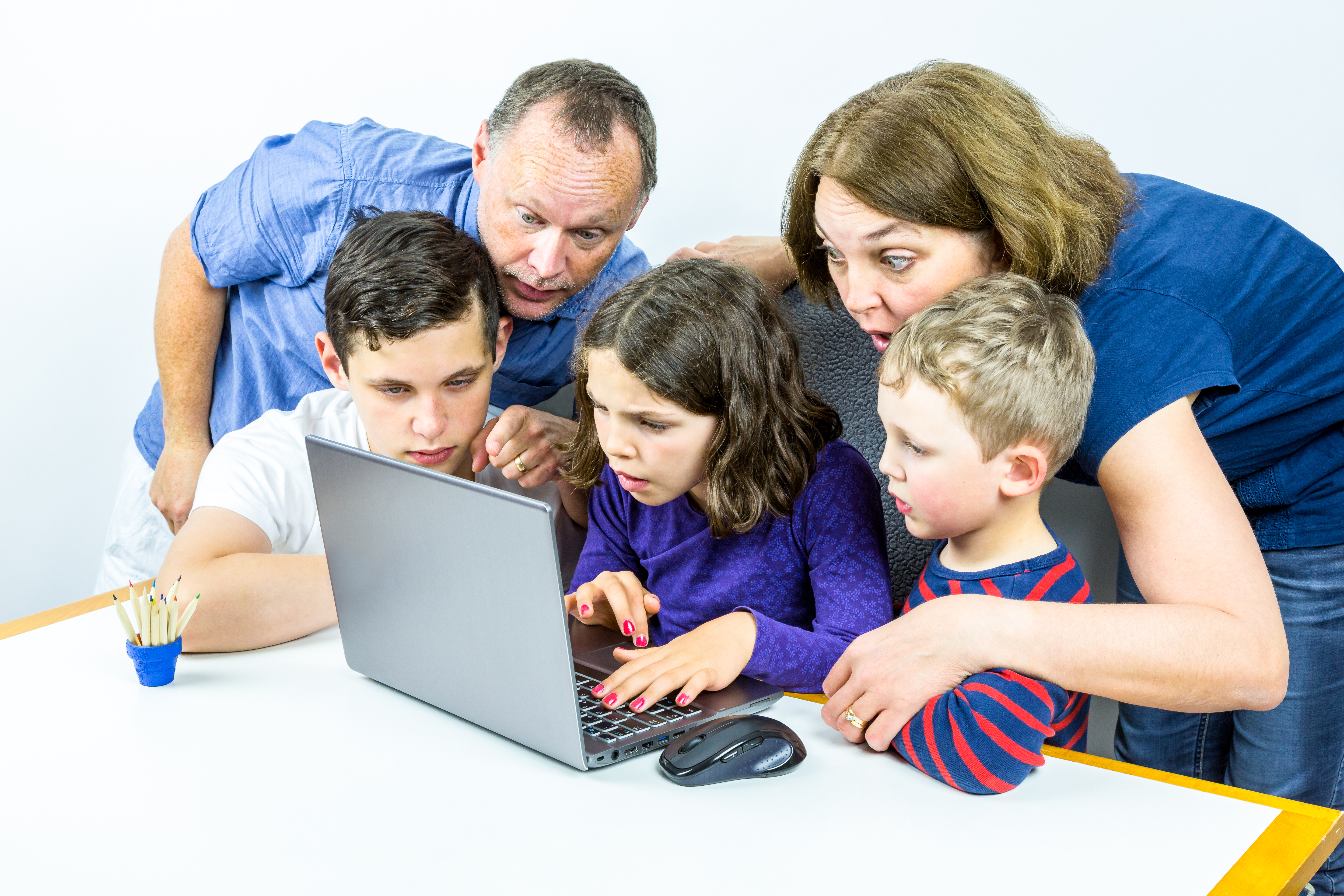 a family gathered around a laptop